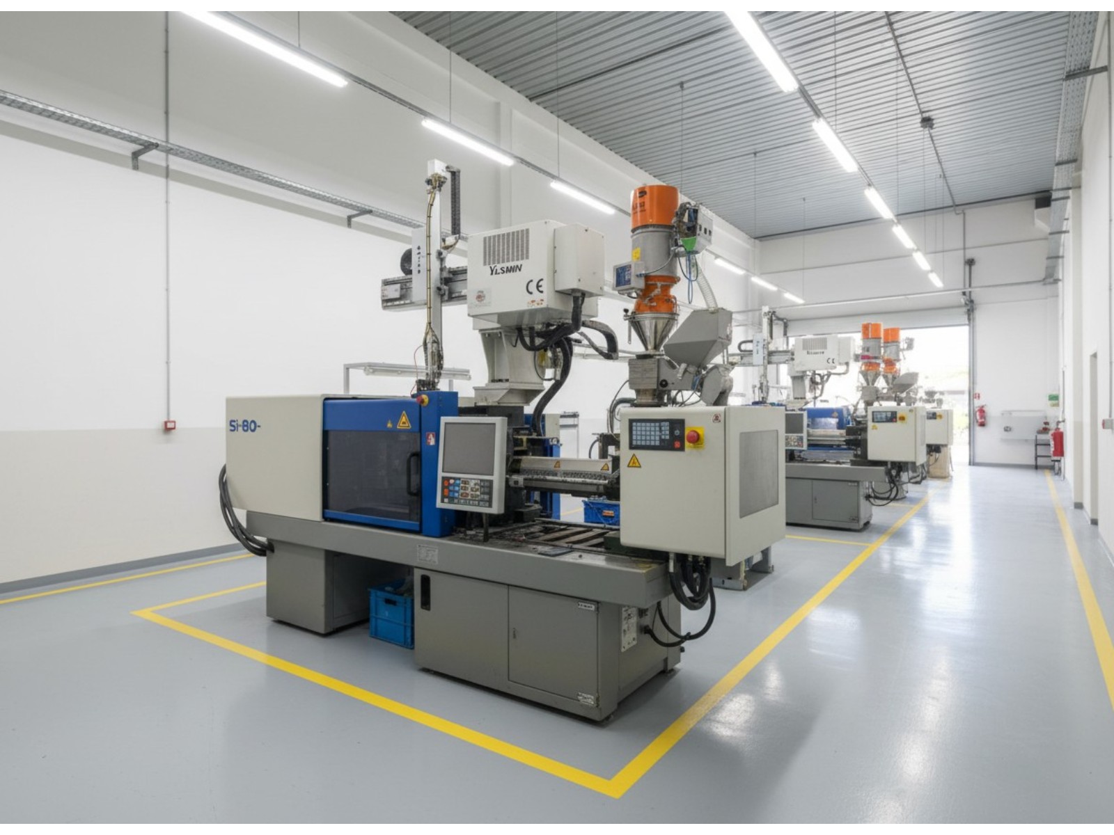 Robot de extraccion Yushin sobre inyectora